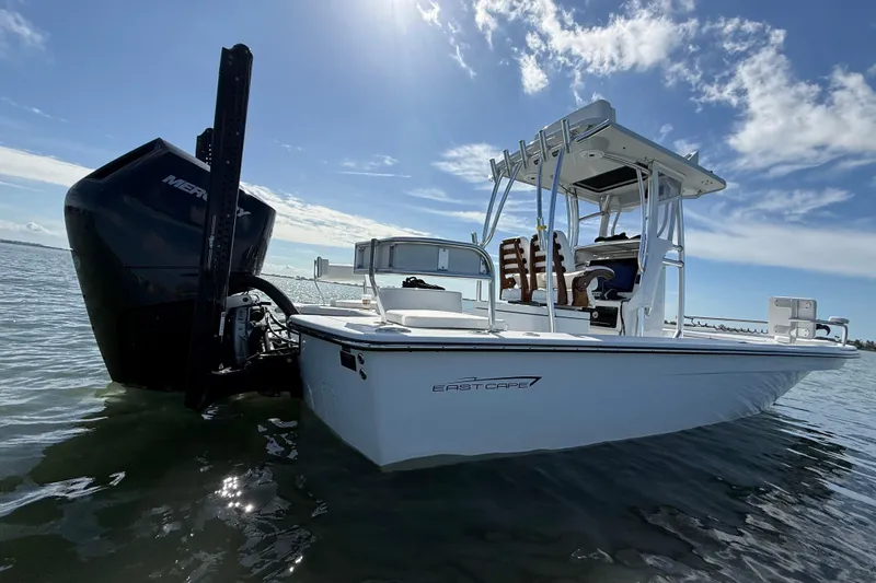 Slide: The Image of 2024 East Cape 25 Hybrid boat on water, featuring sleek design and powerful engine. - 11