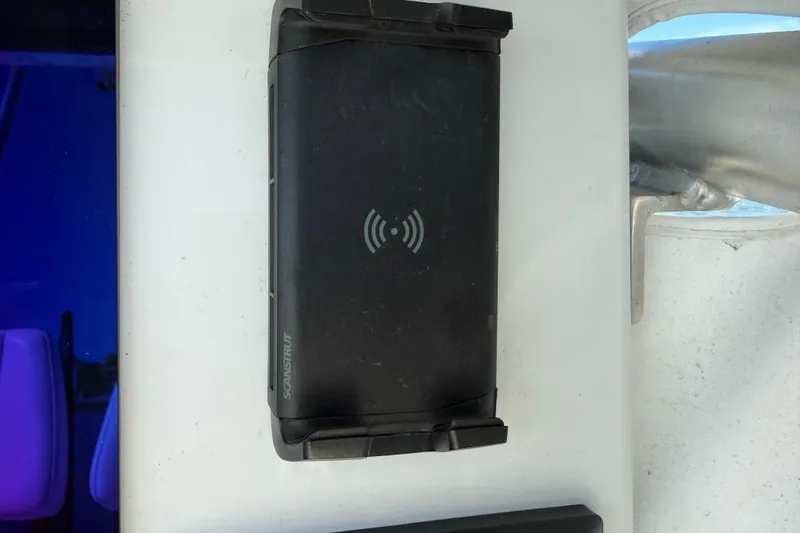 Slide: The Image of Wireless charging pad on 2024 East Cape 25 Hybrid boat. - 26
