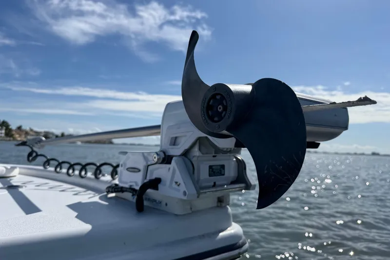 Slide: The Image of Close-up of 2024 East Cape 25 Hybrid boat motor on water. - 36