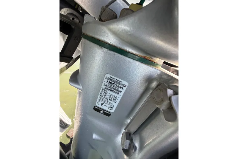 Slide: The Image of Close-up of a 2024 East Cape 25 Hybrid boat engine component with label. - 38