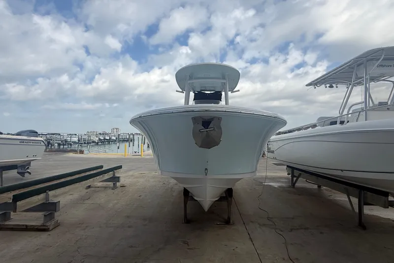Slide: The Image of 2022 Sportsman Open 232 Center Console boat on dock, cloudy sky background. - 3