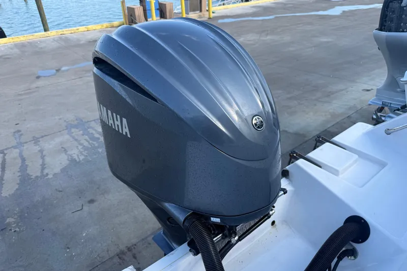Slide: The Image of Yamaha outboard motor on 2022 Sportsman Open 232 Center Console boat at dock. - 51