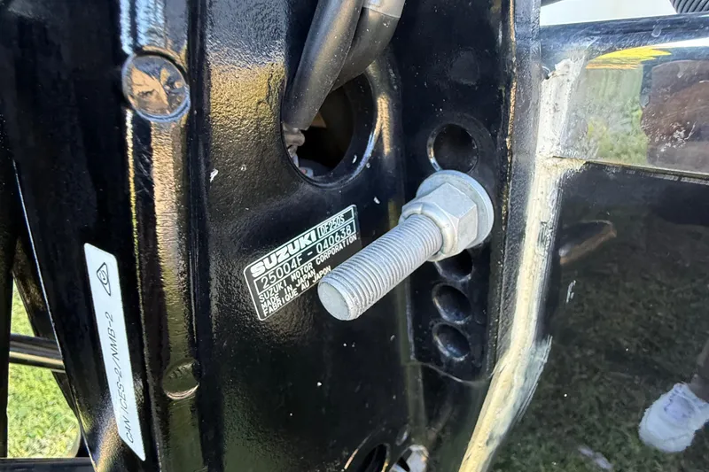 Slide: The Image of Close-up of a 2021 Carolina Skiff 26 Ultra Elite boat's Suzuki motor mount. - 18