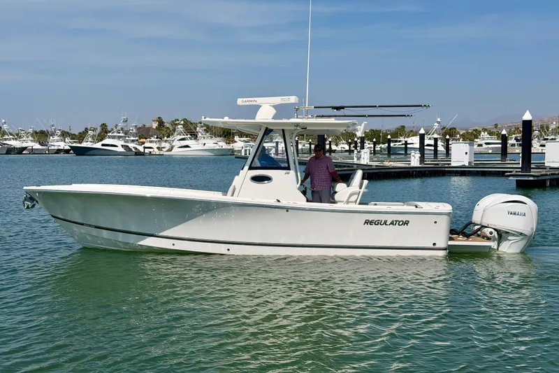 The Image of 2022 Regulator 28 boat with Yamaha engine docked in marina. - 0