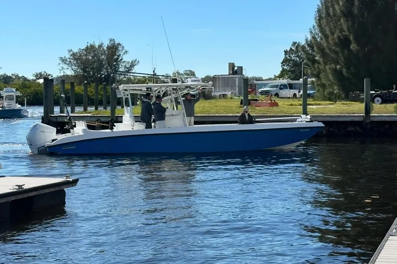Slide: The Image of 2021 Custom Infusion 34 CC boat docked on a sunny day. - 1