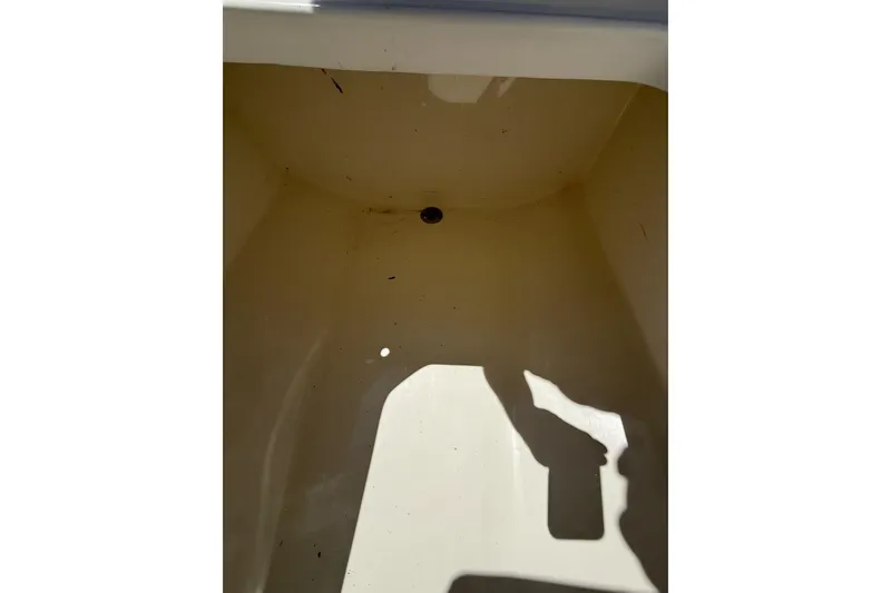 Slide: The Image of Empty storage compartment of 2021 Custom Infusion 34 CC boat. - 39