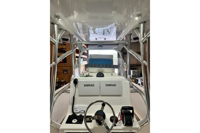 Slide: The Image of 2021 Custom Infusion 34 CC boat cockpit with Simrad navigation system. - 82