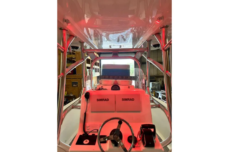 Slide: The Image of Interior view of 2021 Custom Infusion 34 CC boat with Simrad navigation system. - 85