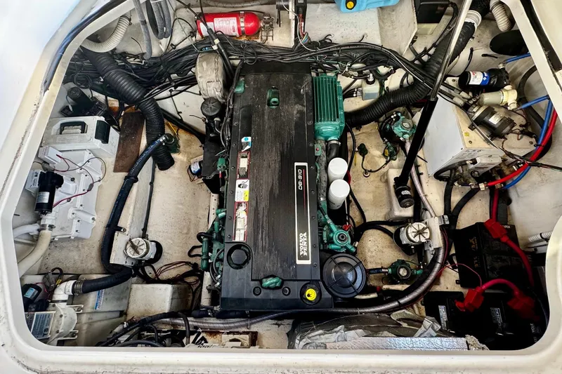 Slide: The Image of Engine compartment of a 2007 Sea Ray 290 Sundancer boat, showcasing mechanical components. - 22