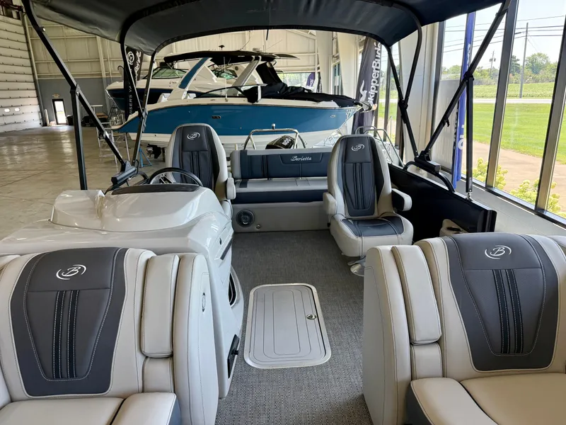 Slide: The Image of Interior view of a 2025 Barletta Corsa 23UC with gray and white seating. - 19