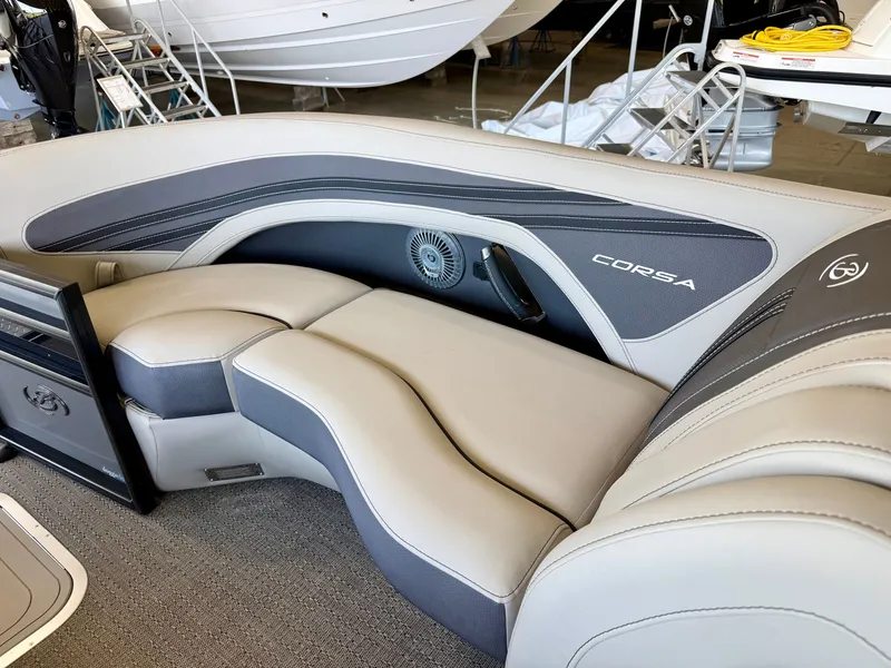 Slide: The Image of The image shows the sleek, gray and cream interior of a 2025 Barletta Corsa 23UC. - 14