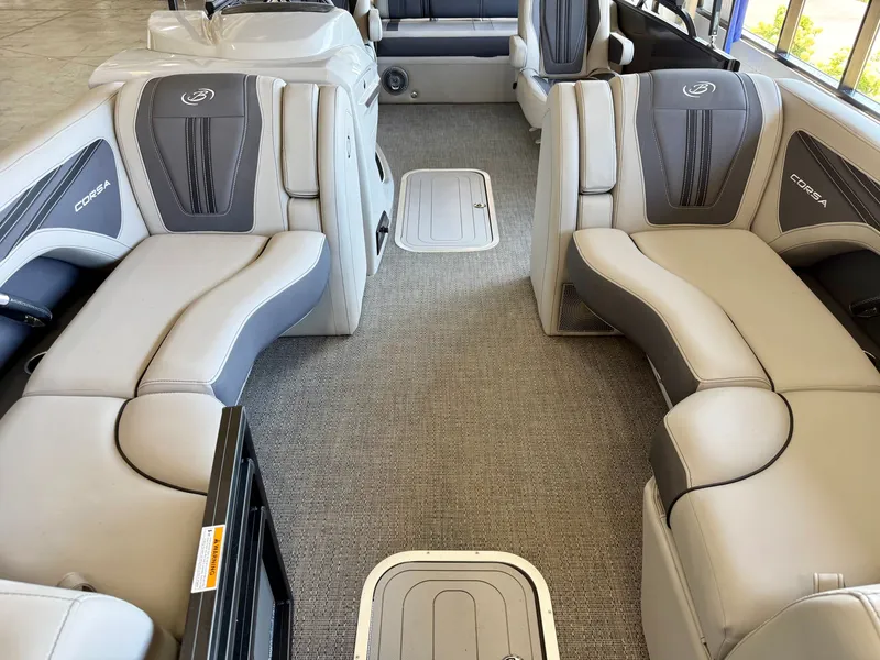 Slide: The Image of Interior of a 2025 Barletta Corsa 23UC with gray and white seating. - 18