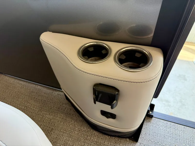 Slide: The Image of Beige boat console with two cup holders and a power outlet. - 23