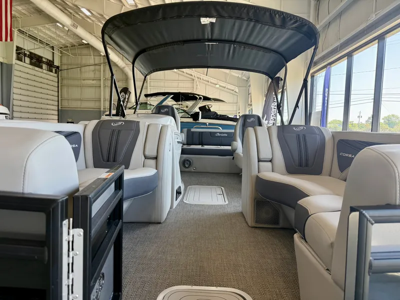 Slide: The Image of Interior of a Barletta Corsa 23UC pontoon boat with luxurious seating and a black sunshade. - 26
