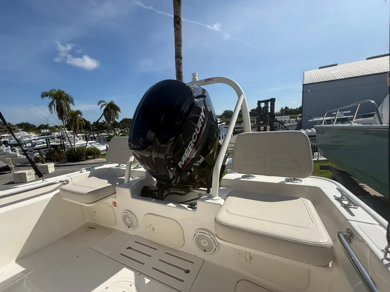 Slide: The Image of The image shows the stern of a Boston Whaler 170 Montauk with a Mercury outboard motor. - 15