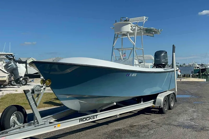 Slide: The Image of A blue boat on a trailer with a tall helm station. - 2