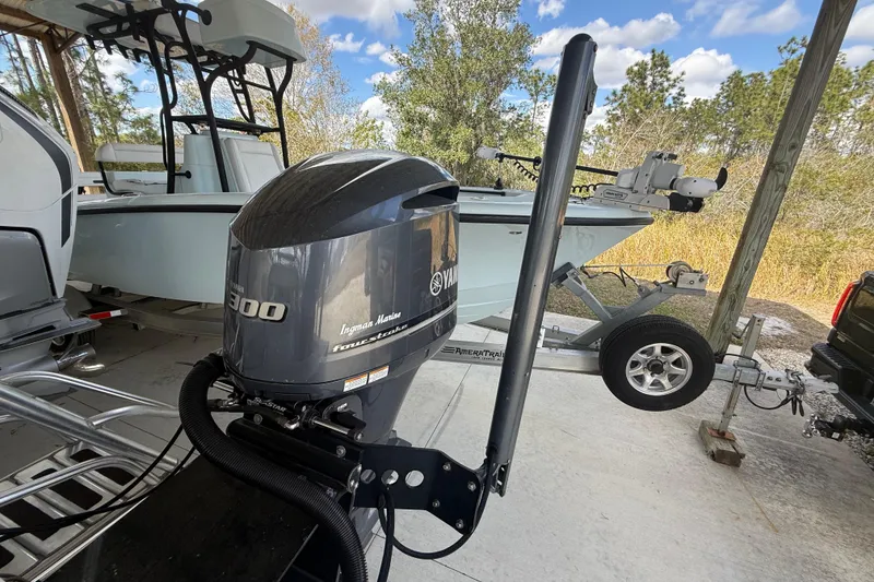 Slide: The Image of 1974 Aquasport 2400 Center Console with Yamaha outboard motor on trailer. - 23