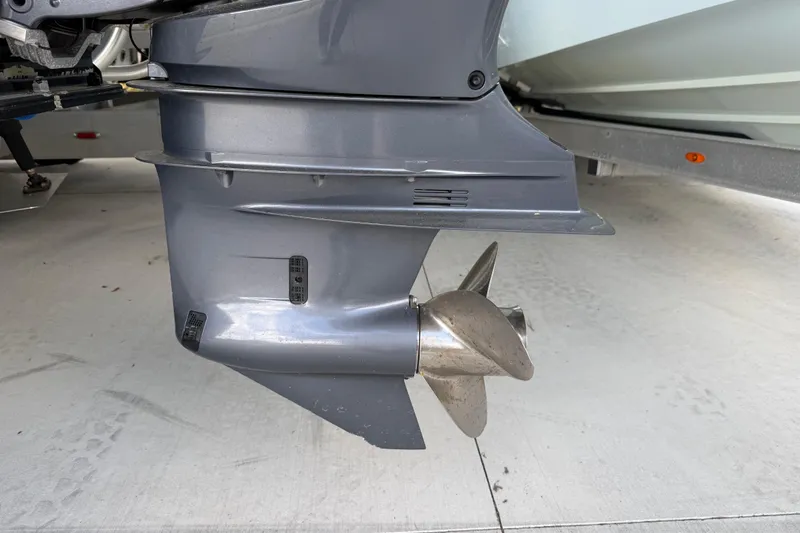 Slide: The Image of Outboard motor propeller of a 1974 Aquasport 2400 Center Console boat. - 43