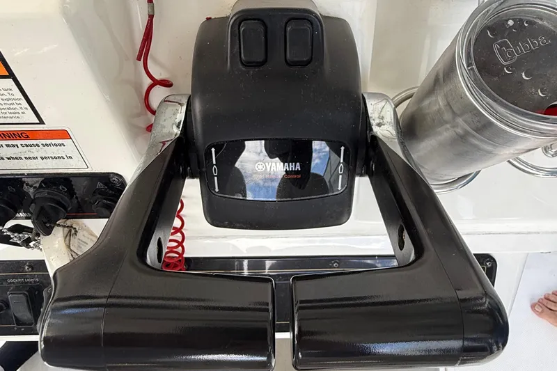 Slide: The Image of Yamaha throttle control on 2008 Century 2901 Center Console boat dashboard. - 35