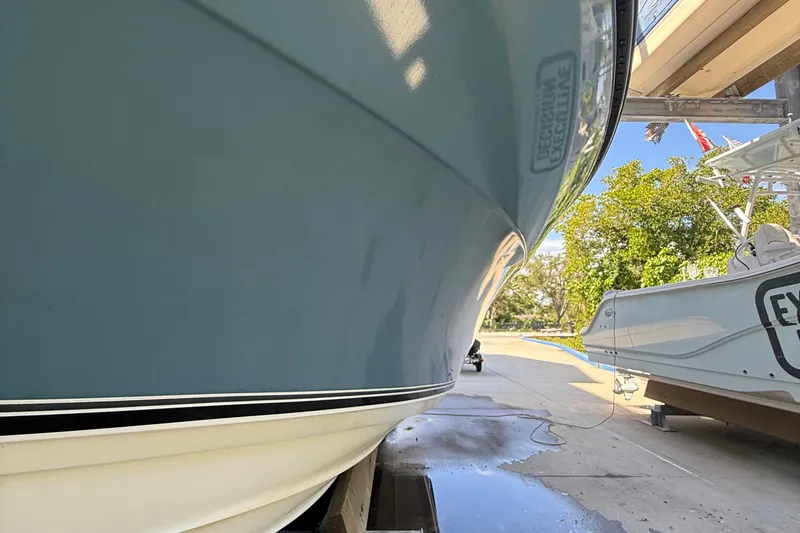 Slide: The Image of 2008 Century 2901 Center Console boat on a trailer, side view, outdoors. - 6