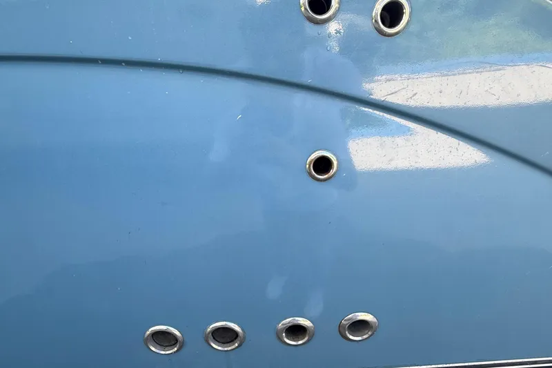 Slide: The Image of Close-up of a 2008 Century 2901 Center Console boat hull with metal fittings. - 9