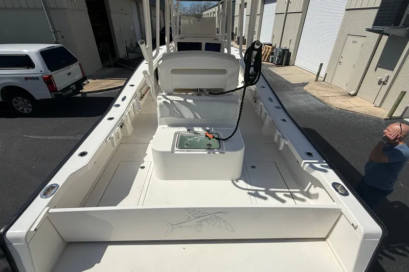 Slide: The Image of 2019 Calcutta 263 boat interior with fishing equipment, parked near industrial buildings. - 22