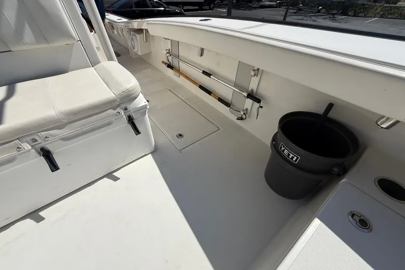 Slide: The Image of Spacious deck of 2019 Calcutta 263 boat with seating and Yeti bucket. - 51