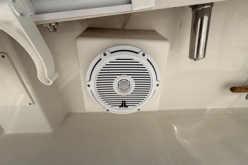 Slide: The Image of White speaker installed on a Calcutta 263 boat, model year 2019. - 56