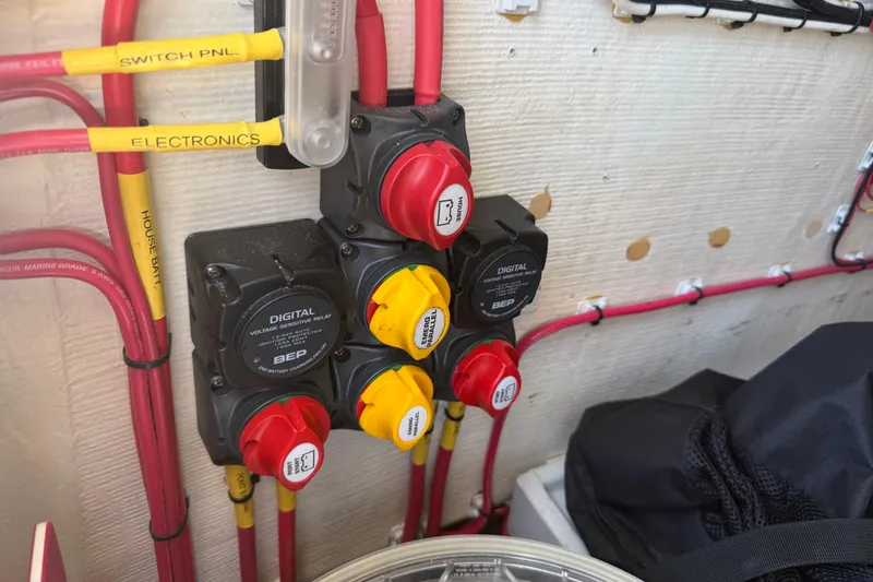 Slide: The Image of Electrical panel with labeled switches and wiring in a 2019 Calcutta 263 boat. - 60