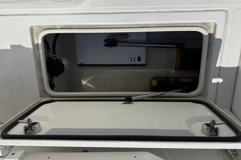 Slide: The Image of Open storage compartment on a 2019 Calcutta 263 boat, showing interior details. - 69