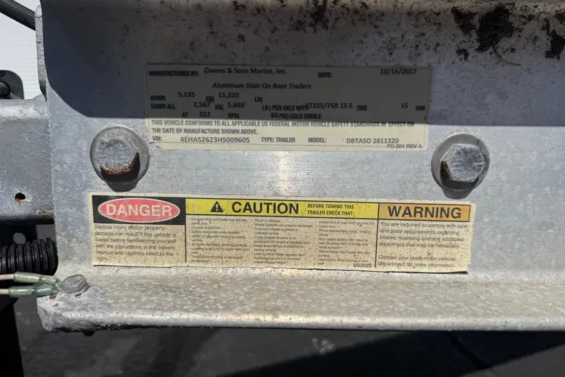 Slide: The Image of Metal trailer label with safety warnings and specifications, Calcutta 263, 2019 model. - 75