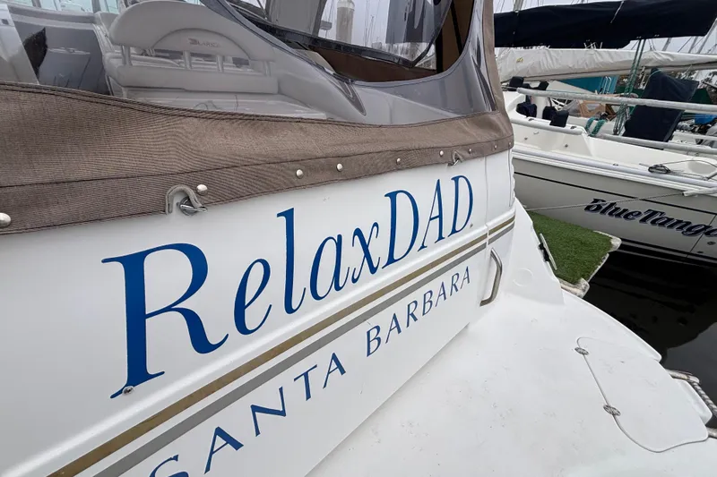 Slide: The Image of Larson 310 boat named "RelaxDAD" docked in Santa Barbara, 2004 model. - 18