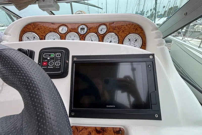 Slide: The Image of Dashboard of a 2004 Larson 310 boat with Garmin navigation system. - 26