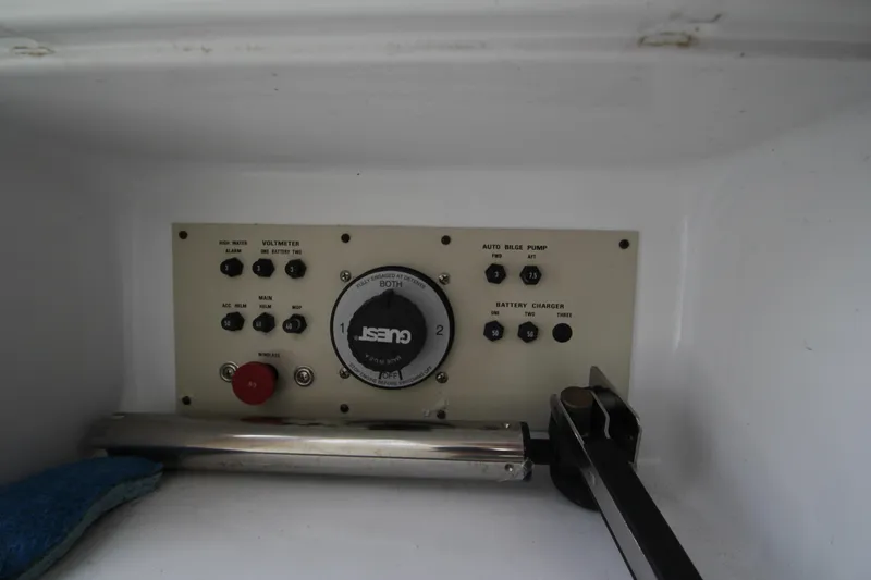 Slide: The Image of A control panel with various switches and a large dial. - 48