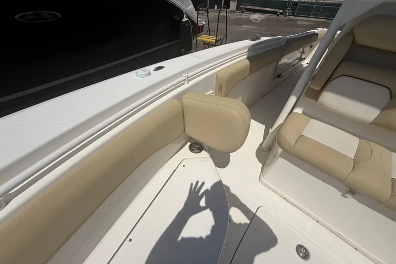 Slide: The Image of 2019 Key West Billistic 281 Center Console interior with beige seating and white deck. - 91