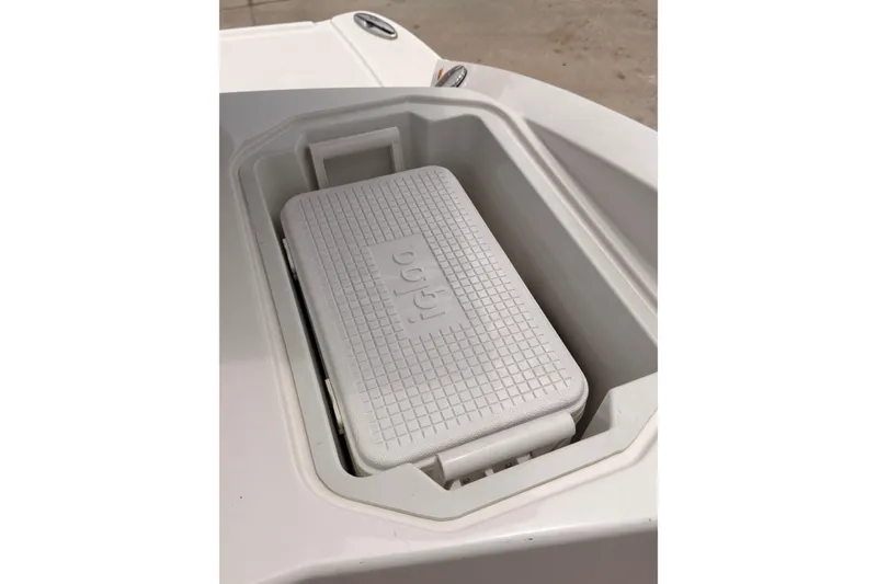 Slide: The Image of White Igloo cooler in a 2012 Chaparral 216 SSi boat compartment. - 22