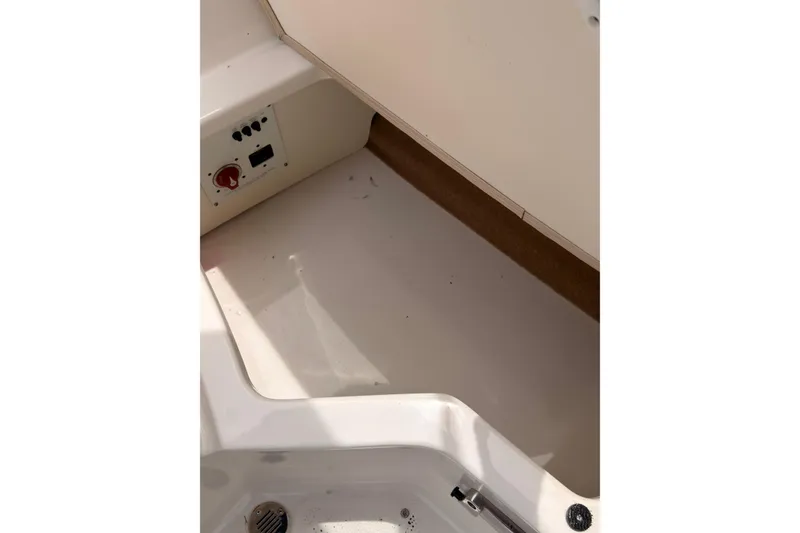 Slide: The Image of Interior storage compartment of a 2012 Chaparral 216 SSi boat. - 32
