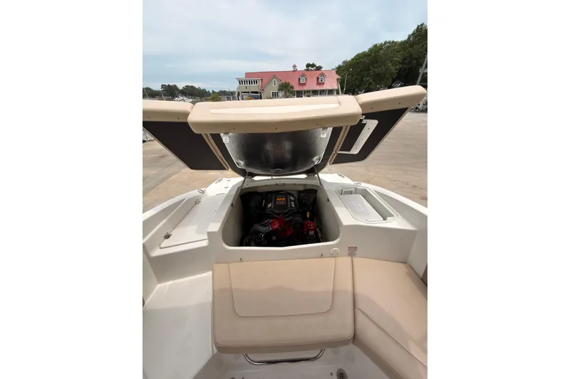 Slide: The Image of 2012 Chaparral 216 SSi boat engine compartment open, showcasing interior details. - 12