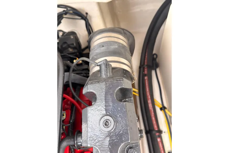Slide: The Image of Engine compartment of a 2012 Chaparral 216 SSi boat, showing hoses and components. - 42