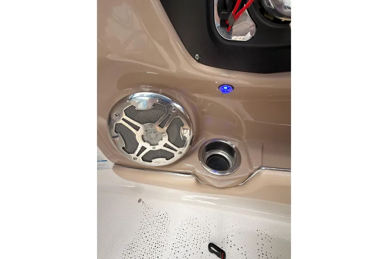 Slide: The Image of Speaker and cup holder on 2012 Chaparral 216 SSi boat interior. - 24