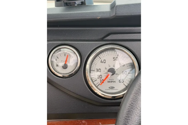 Slide: The Image of Dashboard of 2012 Chaparral 216 SSi showing fuel and speed gauges. - 25