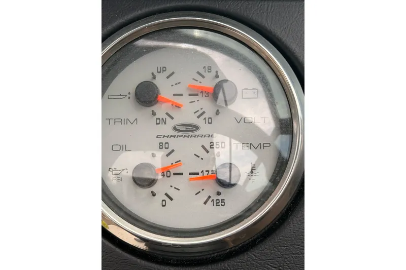 Slide: The Image of Gauge panel of a 2012 Chaparral 216 SSi showing trim, oil, volt, and temperature. - 27