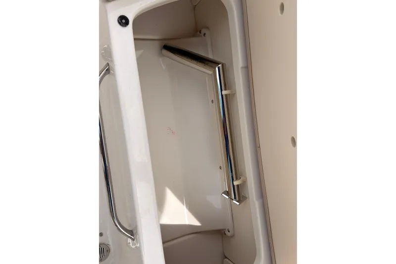 Slide: The Image of Interior compartment of 2012 Chaparral 216 SSi boat with chrome handle. - 30