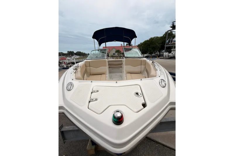 Slide: The Image of 2012 Chaparral 216 SSi with open bow and blue Bimini top. - 7