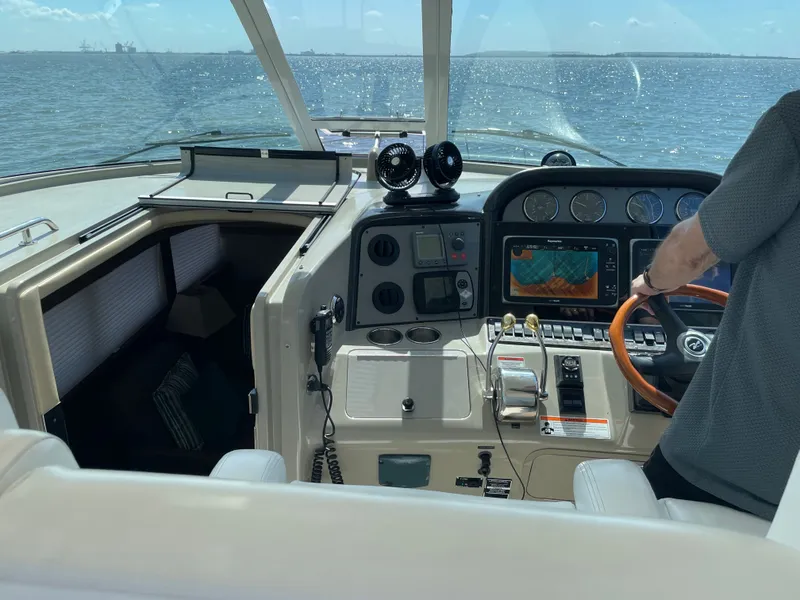 Slide: The Image of The cockpit of a 2007 Sea Ray 40MY with a view of the water. - 12