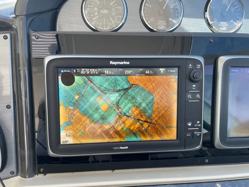 Slide: The Image of A Raymarine navigation system on a boat displaying a map. - 25