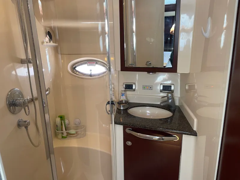 Slide: The Image of Bathroom on a boat with shower, sink, and mirror. - 30