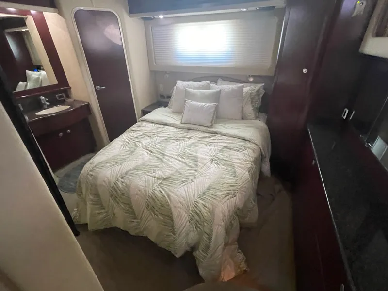 Slide: The Image of Interior of a Sea Ray 40MY yacht featuring a cozy bedroom. - 34