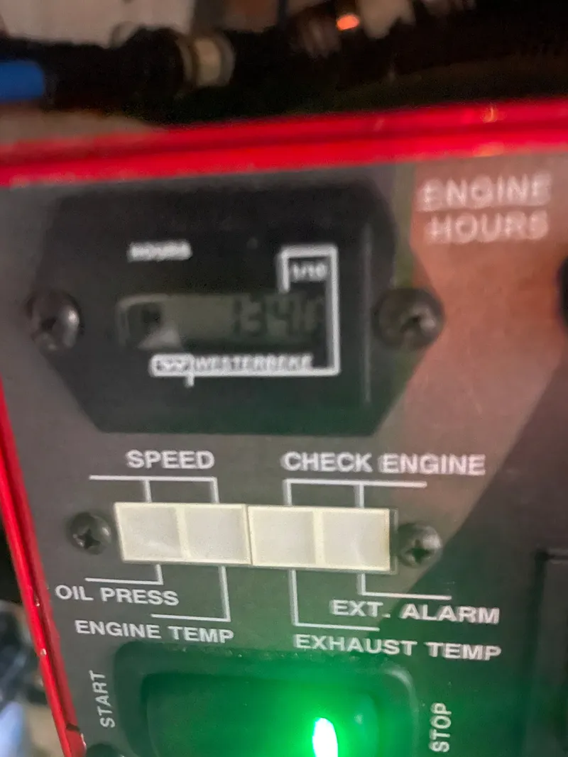 Slide: The Image of Close-up of a boat instrument panel with digital displays and indicator lights. - 43