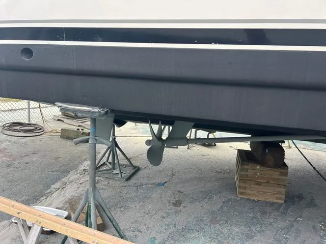 Slide: The Image of A boat on a dry dock with visible propeller and supports. - 48